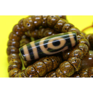 Dzi bead 2 mắt mặt đổi màu thân ngọc A+