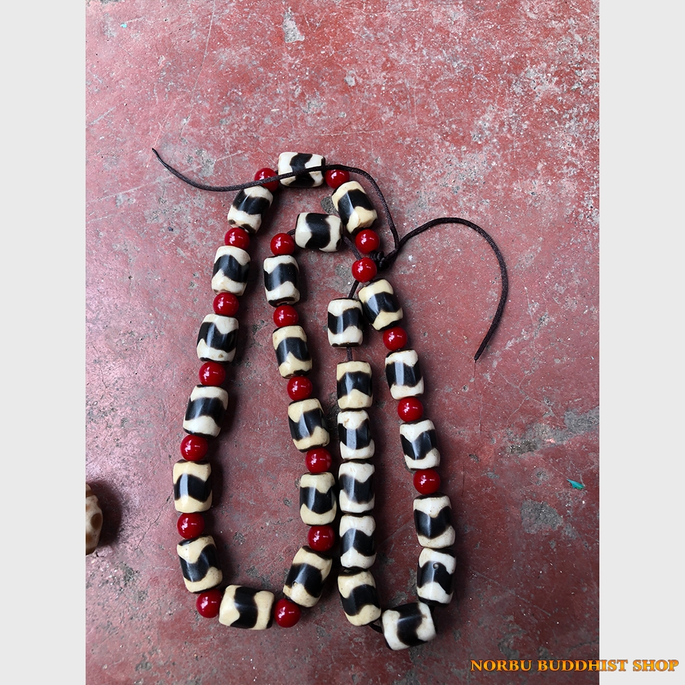 Dzi bead răng hổ old plastic từ Tibet